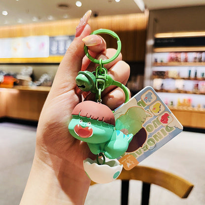 Cartoon Dinosaur Holding Egg PVC Soft Keychain