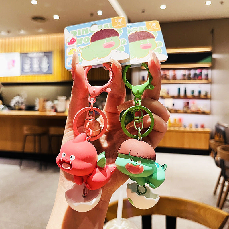 Cartoon Dinosaur Holding Egg PVC Soft Keychain