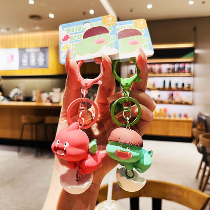 Cartoon Dinosaur Holding Egg PVC Soft Keychain