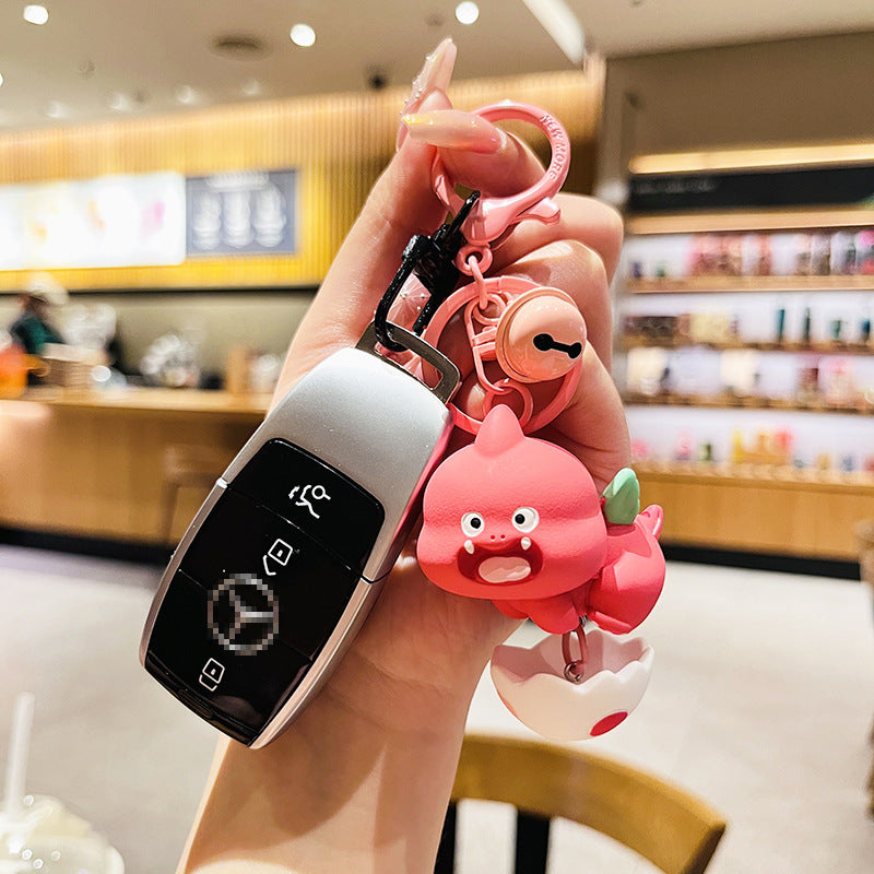 Cartoon Dinosaur Holding Egg PVC Soft Keychain