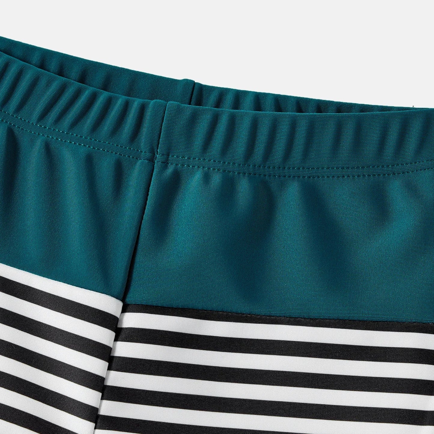 Family Matching: One-Shoulder Swimsuits & Striped Trunks