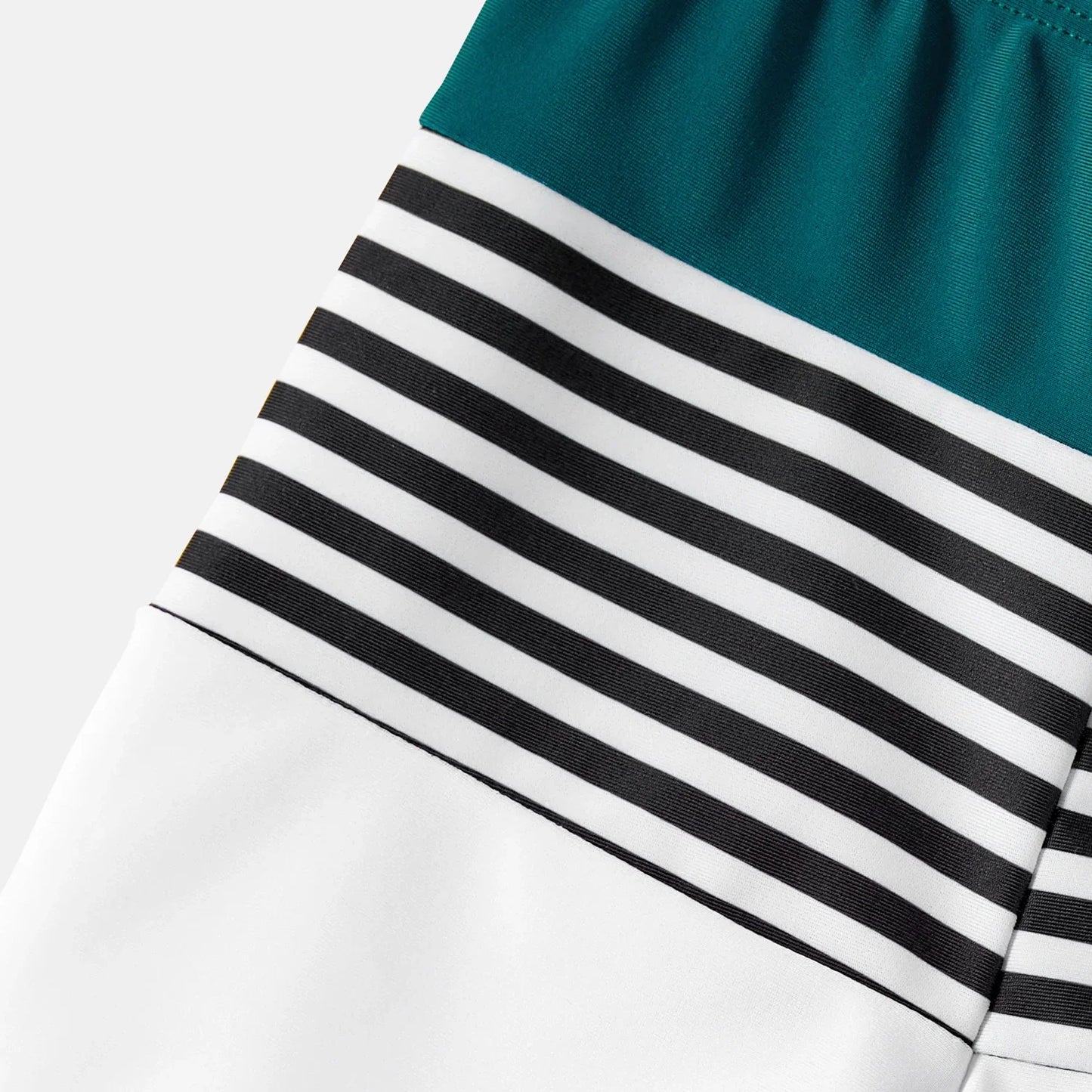 Family Matching: One-Shoulder Swimsuits & Striped Trunks