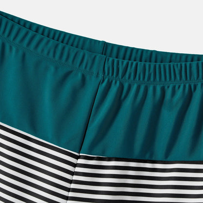 Family Matching: One-Shoulder Swimsuits & Striped Trunks
