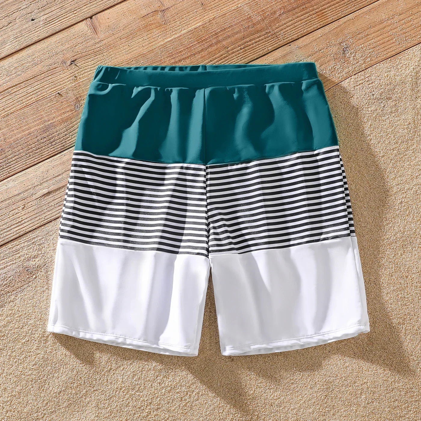 Family Matching: One-Shoulder Swimsuits & Striped Trunks
