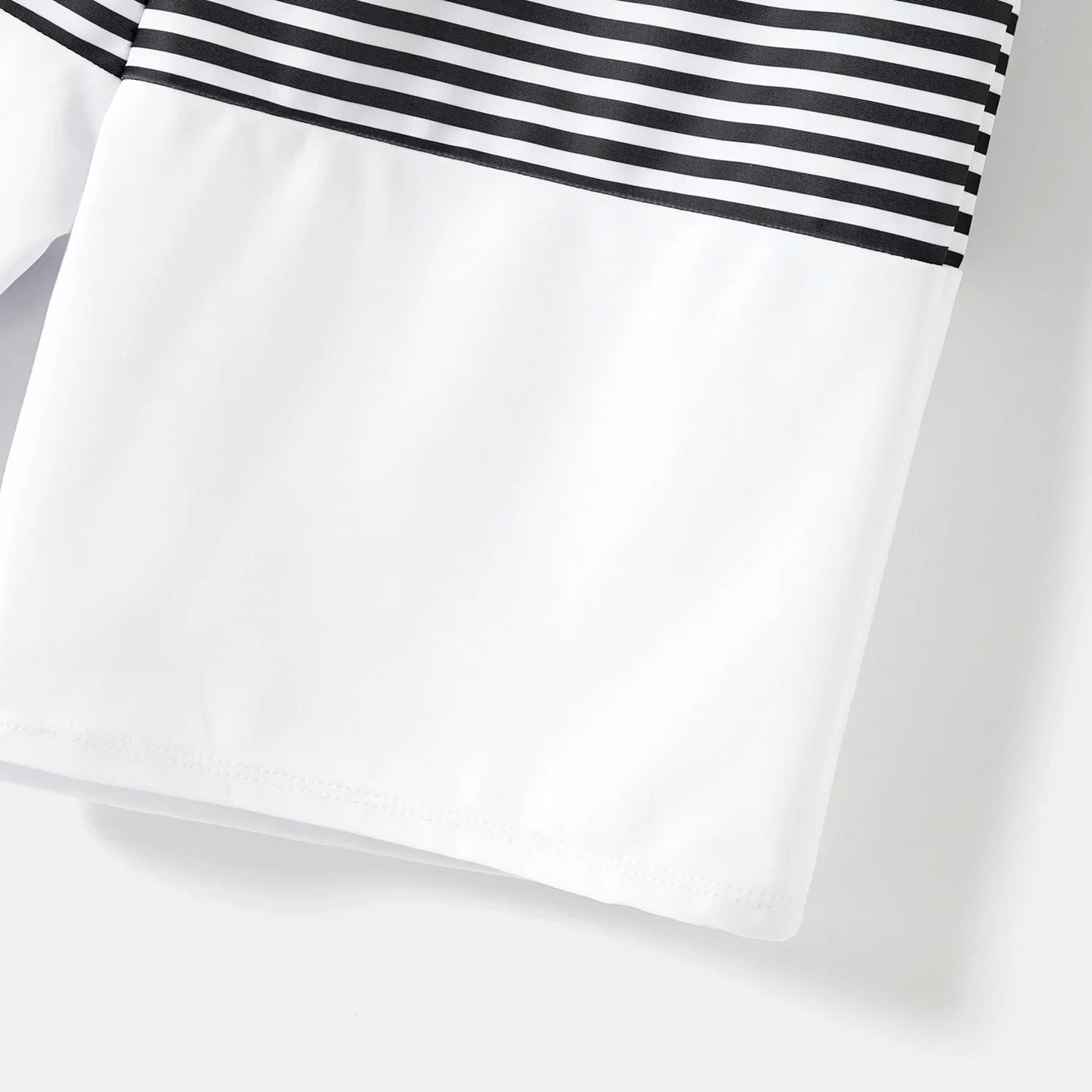 Family Matching: One-Shoulder Swimsuits & Striped Trunks