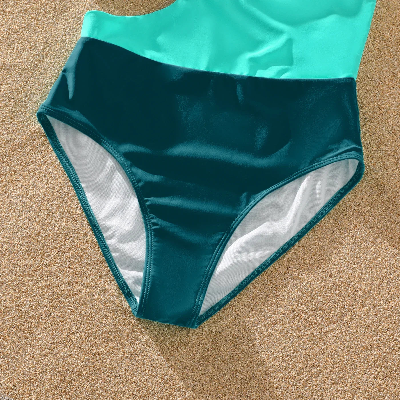 Family Matching: One-Shoulder Swimsuits & Striped Trunks